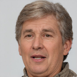 Joyful white middle-aged male with short  brown hair and brown eyes