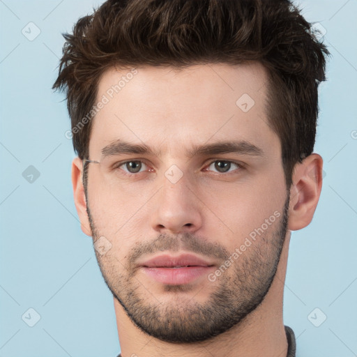 Neutral white young-adult male with short  brown hair and brown eyes