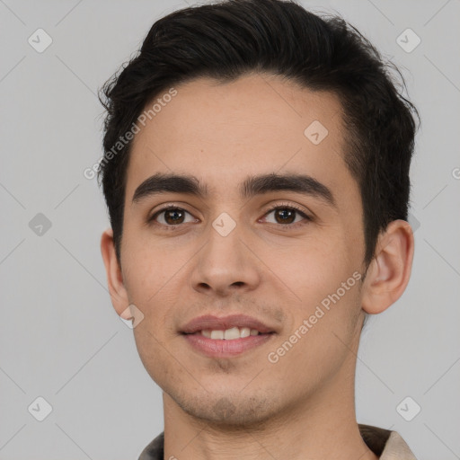 Joyful white young-adult male with short  black hair and brown eyes