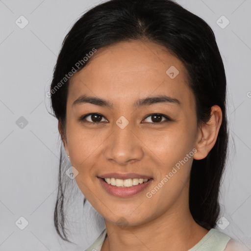 Joyful latino young-adult female with medium  black hair and brown eyes