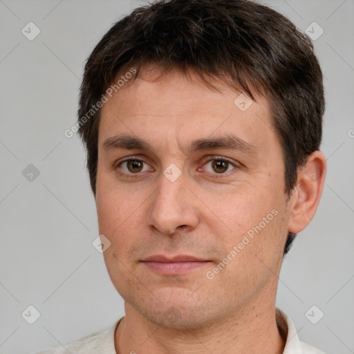 Joyful white adult male with short  brown hair and brown eyes