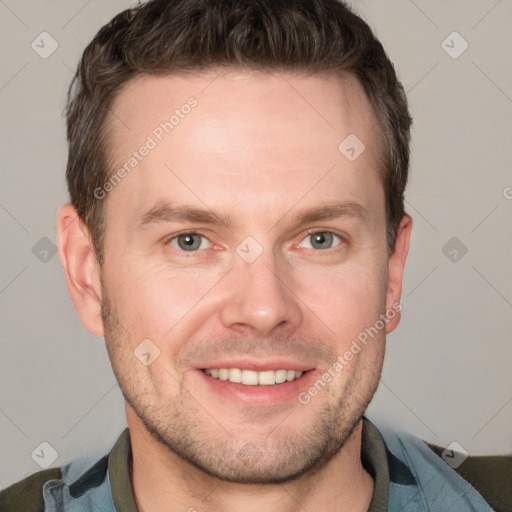 Joyful white adult male with short  brown hair and grey eyes