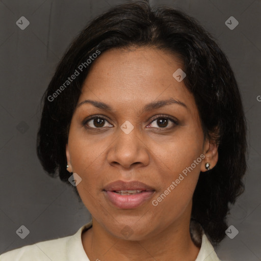 Joyful black adult female with medium  brown hair and brown eyes