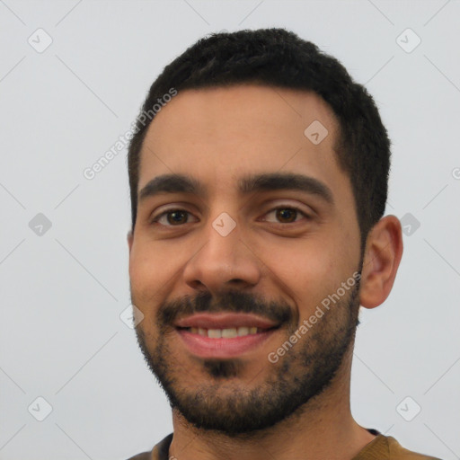 Joyful latino young-adult male with short  black hair and brown eyes