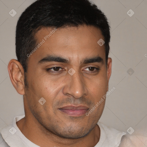 Joyful latino young-adult male with short  brown hair and brown eyes