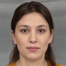 Neutral white young-adult female with medium  brown hair and brown eyes