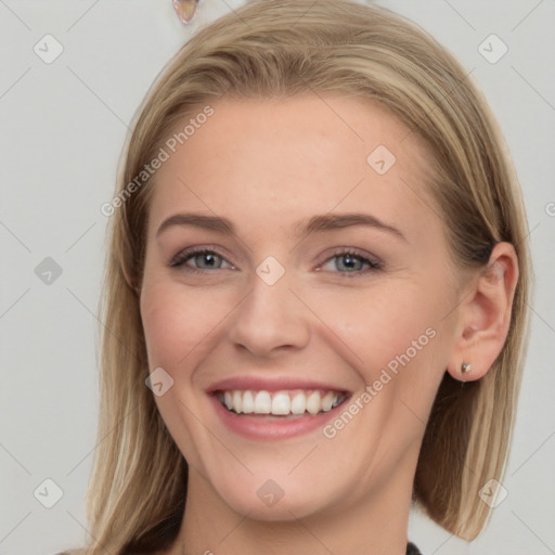 Joyful white young-adult female with long  brown hair and grey eyes