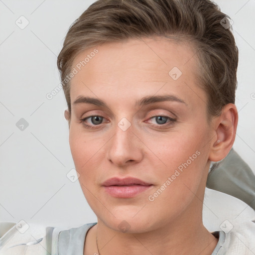 Joyful white young-adult female with short  brown hair and grey eyes