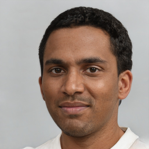 Neutral black young-adult male with short  black hair and brown eyes