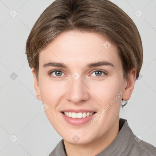 Joyful white young-adult female with short  brown hair and grey eyes