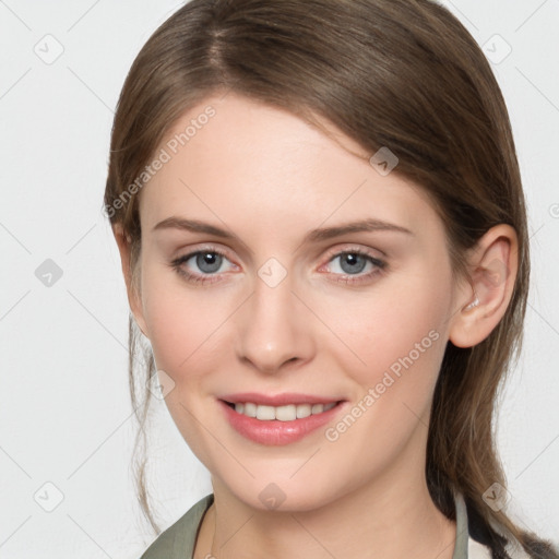 Joyful white young-adult female with medium  brown hair and grey eyes