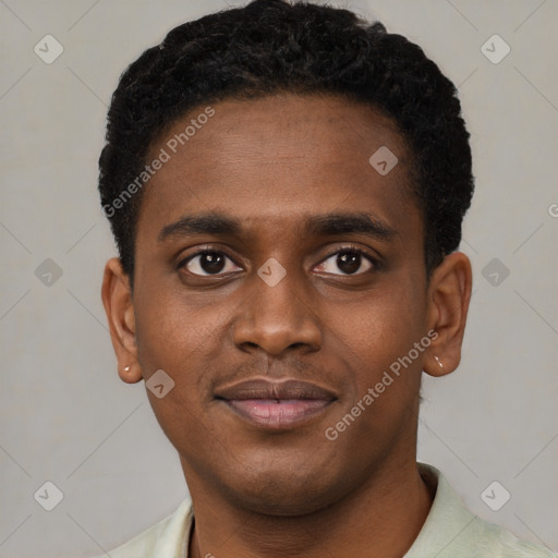 Joyful black young-adult male with short  black hair and brown eyes