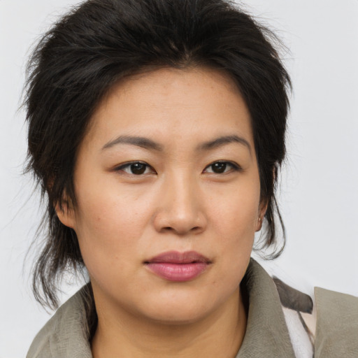Joyful asian young-adult female with medium  brown hair and brown eyes