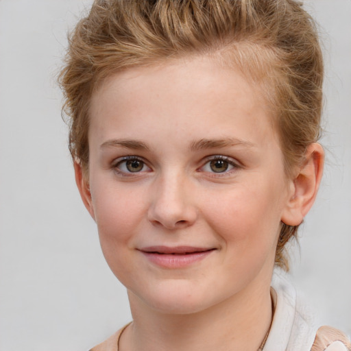 Joyful white child female with short  brown hair and brown eyes