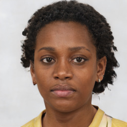 Neutral black young-adult female with short  brown hair and brown eyes