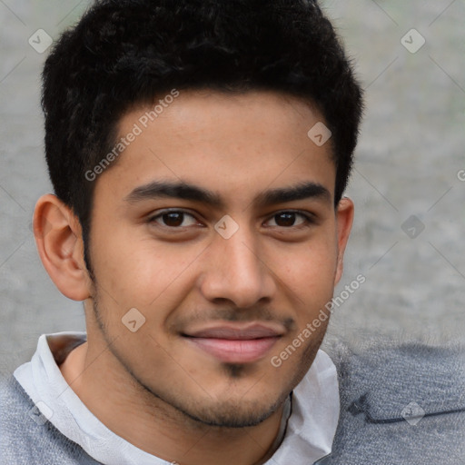 Joyful latino young-adult male with short  brown hair and brown eyes