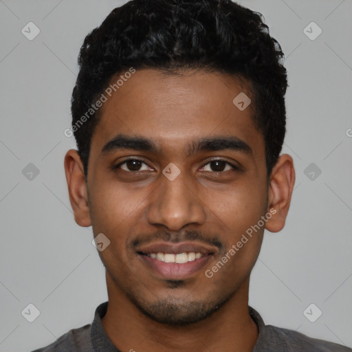 Joyful black young-adult male with short  black hair and brown eyes