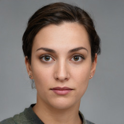 Neutral white young-adult female with short  brown hair and brown eyes