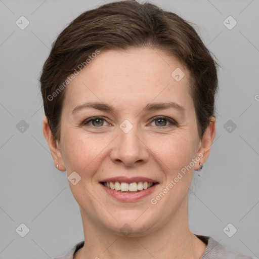 Joyful white young-adult female with short  brown hair and grey eyes