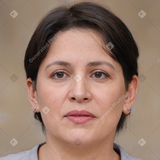 Joyful white adult female with medium  brown hair and brown eyes