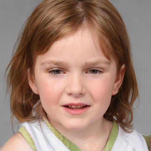 Joyful white child female with medium  brown hair and blue eyes