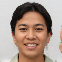 Joyful asian young-adult female with short  brown hair and brown eyes