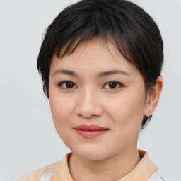 Joyful asian young-adult female with medium  brown hair and brown eyes