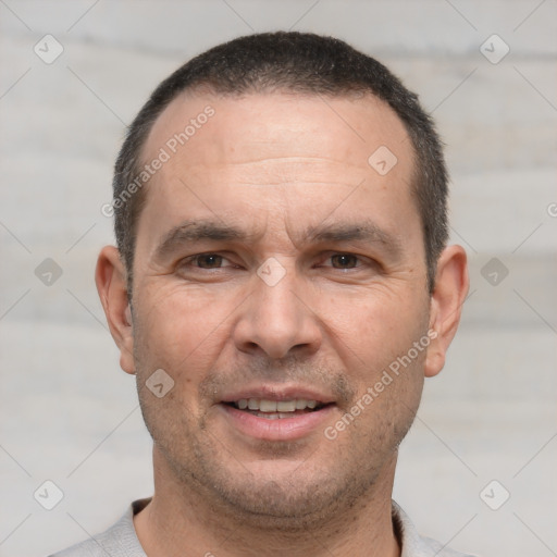 Joyful white adult male with short  brown hair and brown eyes