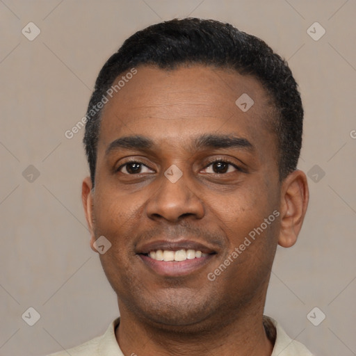 Joyful latino young-adult male with short  black hair and brown eyes