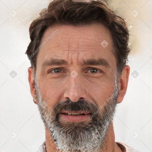 Joyful white adult male with short  black hair and brown eyes