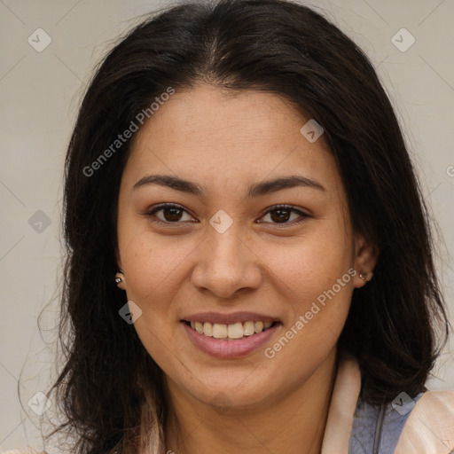 Joyful latino young-adult female with long  brown hair and brown eyes