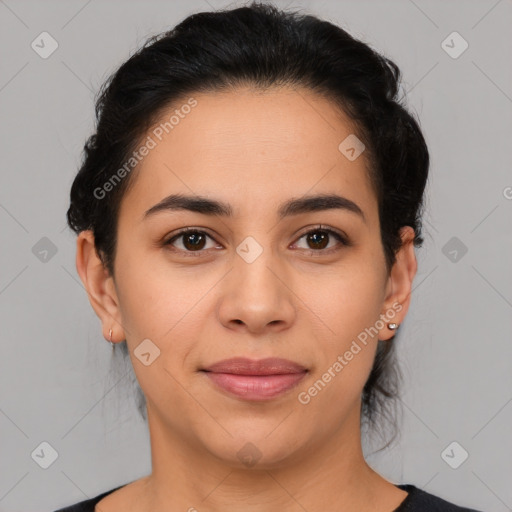 Joyful latino young-adult female with medium  brown hair and brown eyes