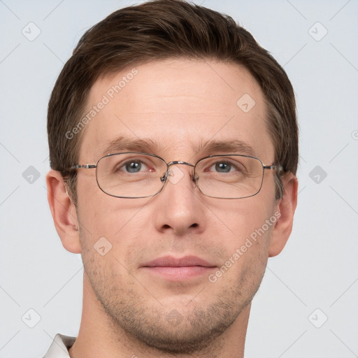 Joyful white adult male with short  brown hair and grey eyes