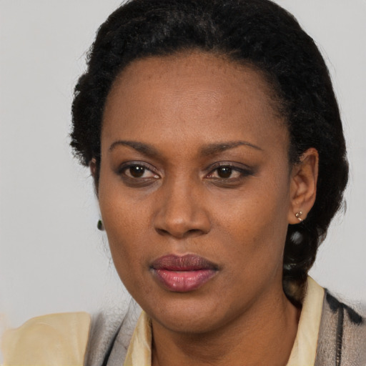 Neutral black adult female with short  black hair and brown eyes