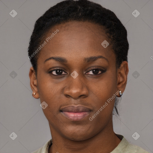 Joyful black young-adult female with short  black hair and brown eyes