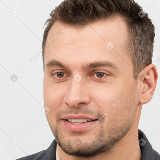 Joyful white young-adult male with short  brown hair and brown eyes