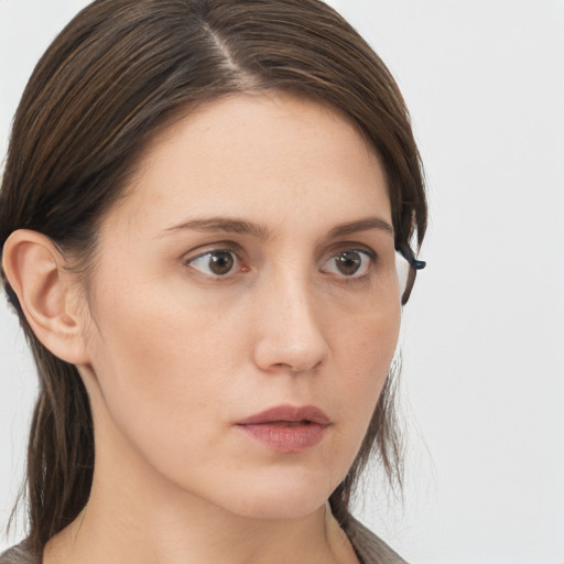 Neutral white young-adult female with long  brown hair and brown eyes