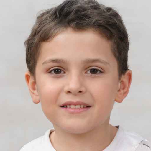 Joyful white child male with short  brown hair and brown eyes