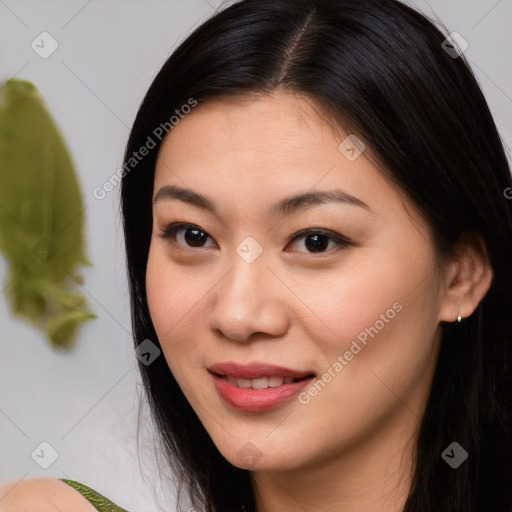 Joyful asian young-adult female with long  brown hair and brown eyes