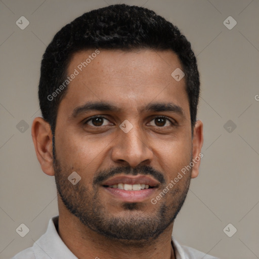 Joyful black young-adult male with short  black hair and brown eyes