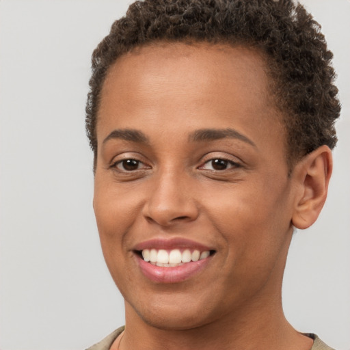 Joyful white young-adult female with short  brown hair and brown eyes