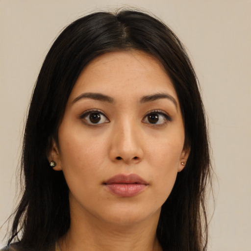 Neutral latino young-adult female with long  brown hair and brown eyes