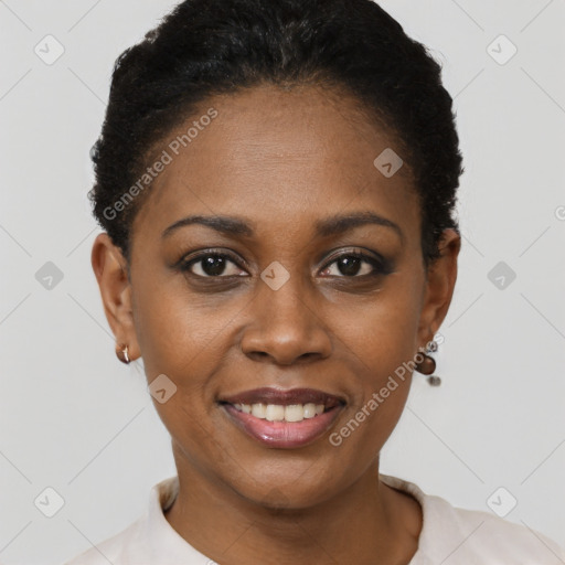 Joyful black young-adult female with short  brown hair and brown eyes