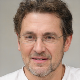 Joyful white middle-aged male with short  brown hair and brown eyes