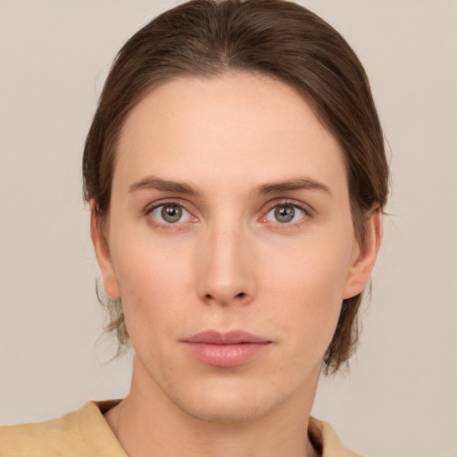 Neutral white young-adult female with medium  brown hair and grey eyes