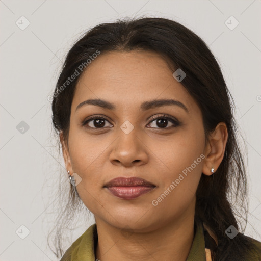 Joyful latino young-adult female with long  brown hair and brown eyes