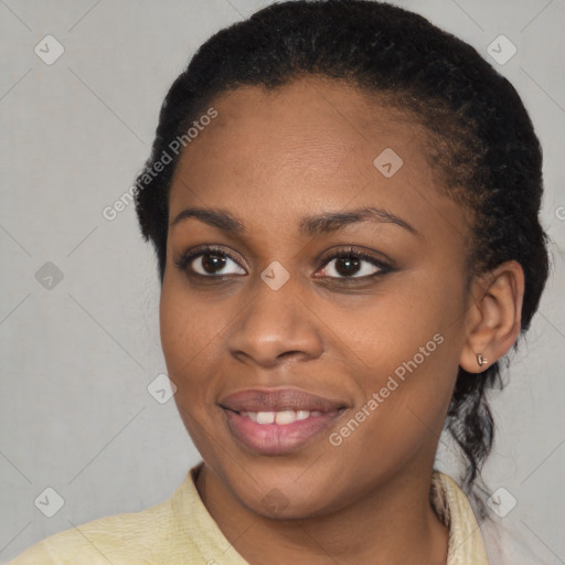 Joyful black young-adult female with short  brown hair and brown eyes