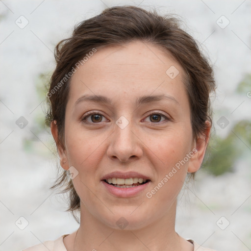 Joyful white young-adult female with medium  brown hair and green eyes