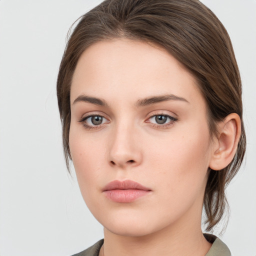 Neutral white young-adult female with medium  brown hair and grey eyes