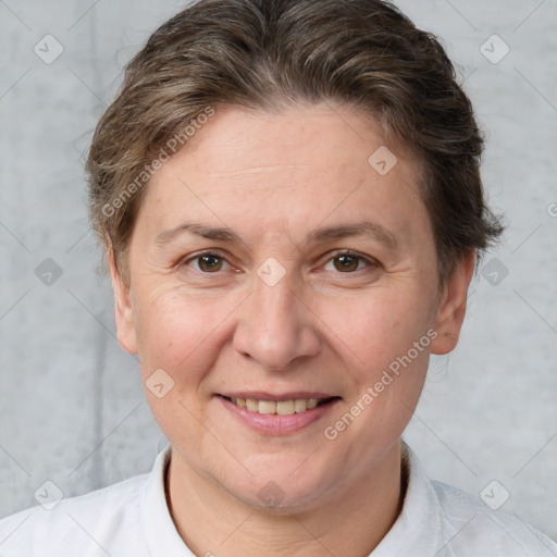 Joyful white adult female with short  brown hair and brown eyes